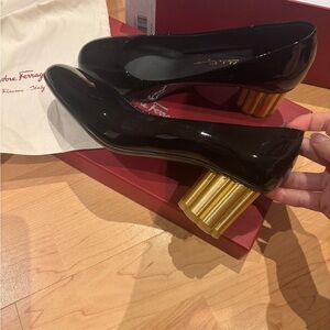 Salvatore Ferragamo Black Patent Heels with Gold Cylindrical Accent
